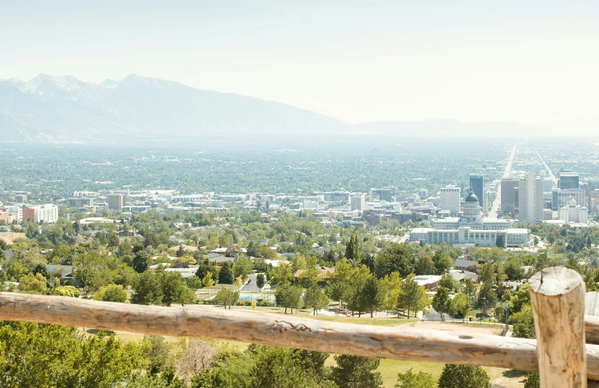 View across Salt Lake City with a split-rail fence in the foreground